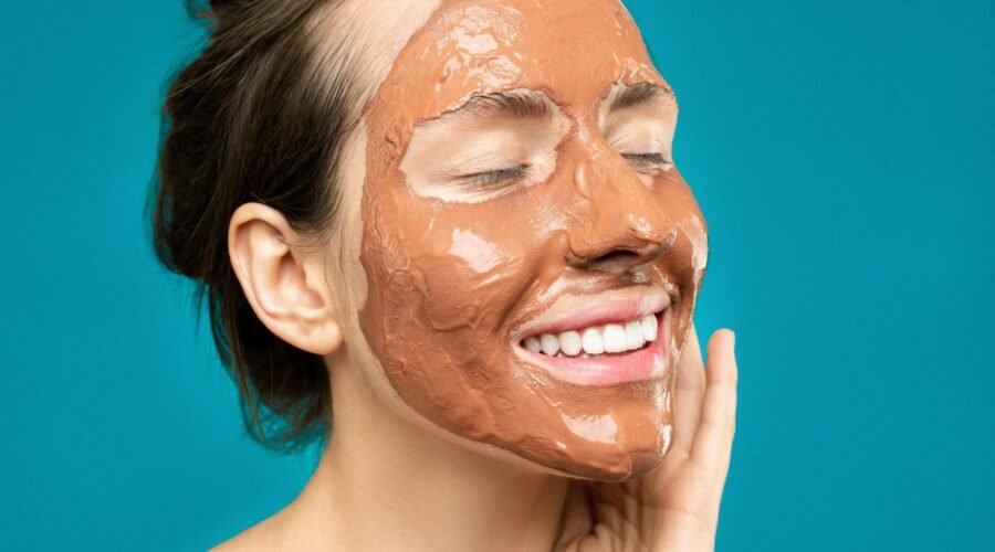 woman with clay mask on face